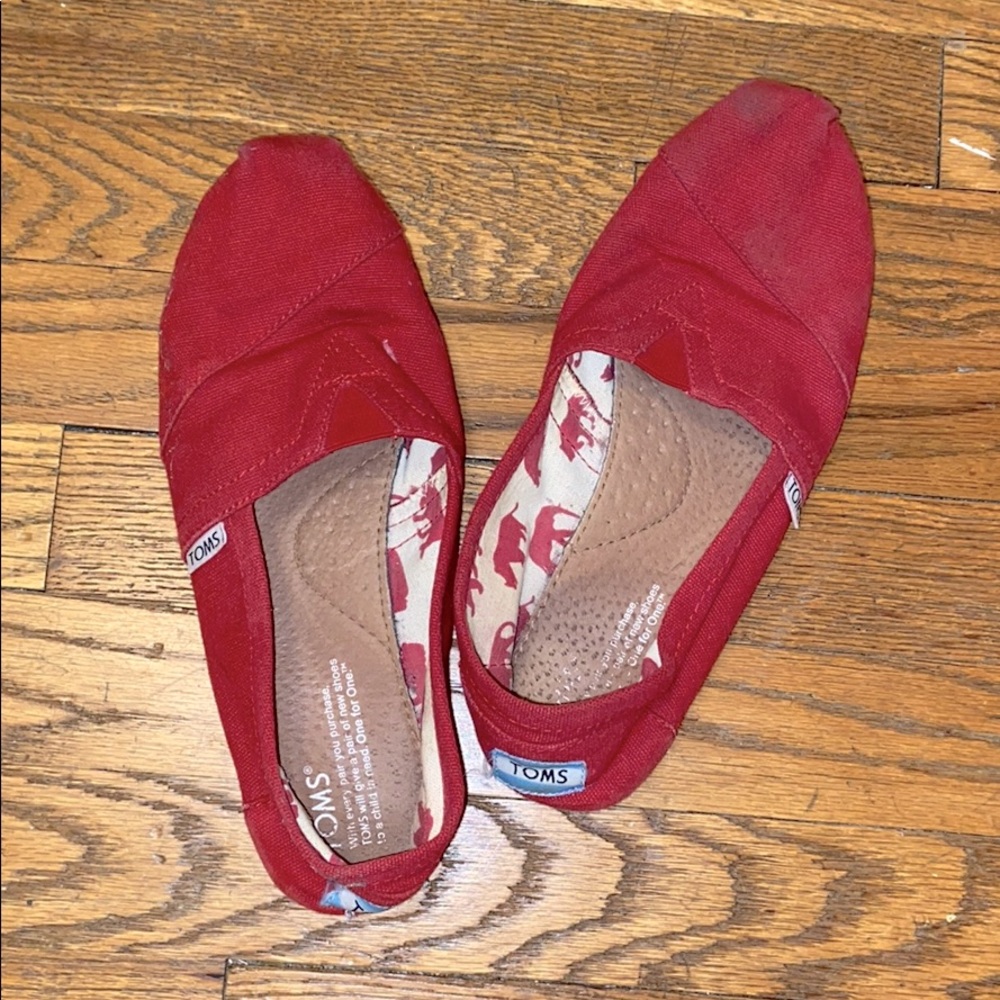 Red TOMS canvas shoes